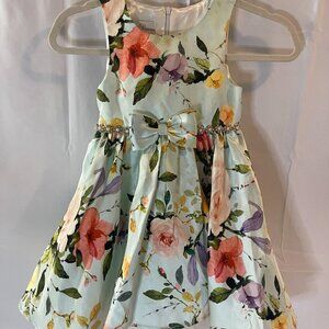 COUTURE PRINCESS. SIZE 6 IN LONG PRINCESS-CUT FLOWERED POLYESTER.